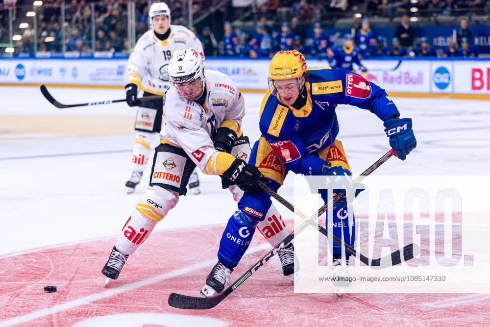 Nick Shore 73, HC Lugano, stops top scorer Vinzenz Rohrer, EV Zug 27, October 10, 2026, National League, Regular Season, Ice Hockey, OYM Hall, Zug, EV Zug vs. HC Lugano. Photo by