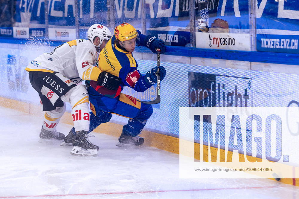 Top scorer Vinzenz Rohrer of EV Zug in a one-on-one battle, October 27, 2026, National League, Regular Season, Ice Hockey, OYM Hall, Zug EV Zug vs. HC Lugano. Photo by