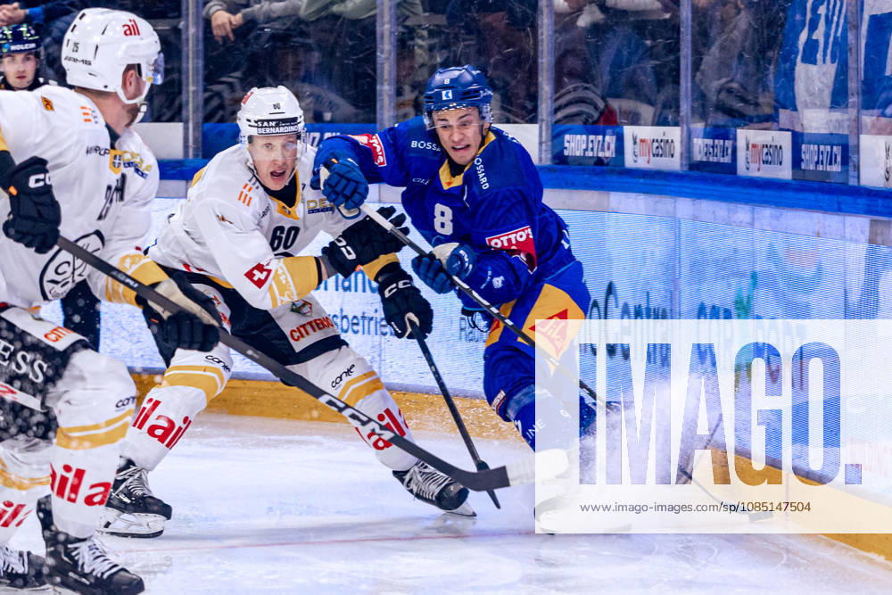 Lassi Thomson 60 HC Lugano and Rico Gredig 8 EV Zug 27 10 2026 National League, Regular Season, Ice Hockey, OYM Hall, Zug EV Zug HC Lugano Photo by