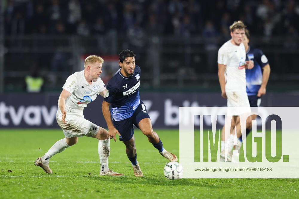 Soccer, Men s, DFB Cup, 2nd Round, SSV Jeddeloh II vs. Hertha BSC Berlin, Kevin Sessa 8 (Hertha BSC Berlin) in a tackle with Robin Krolikowski 16 (SSV Jeddeloh II)
