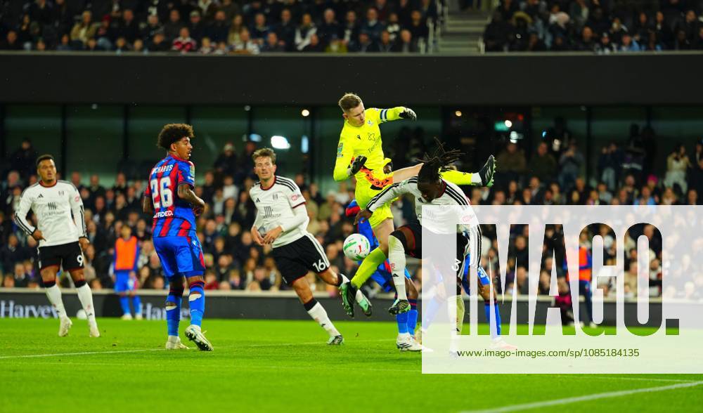Calvin Bassey of Fulham tangles with Crystal Palace goalkeeper Dean Henderson Fulham v Crystal Palace, EFL Carabao Cup, Football, Craven Cottage, London, UK - 28 Oct 2026London Craven Cottage United Kingdom