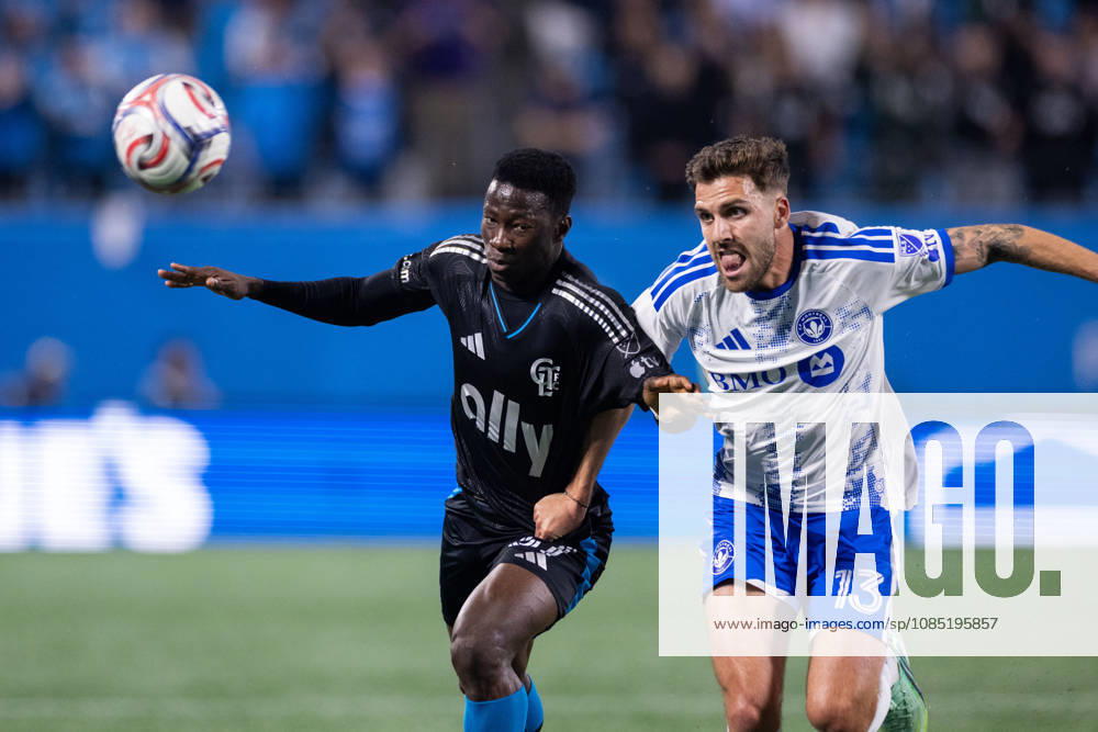 Charlotte FC forward Rodolfo Aloko (37) and CF Montreal defender Luca Petrasso (13) chase the loose ball during the first half of the MLS, Fussball Herren, USA match up at Bank of America Stadium in Charlotte, NC. Mandatory Credit: -Cal Media Charlotte United States - ZUMAc04_ 20261028_zma_c04_007