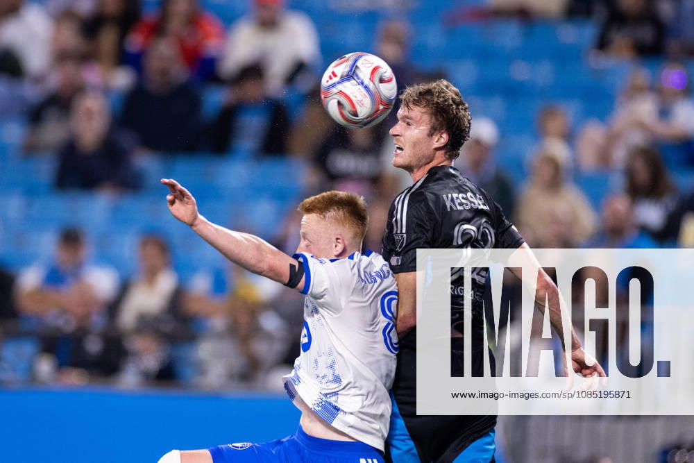 Charlotte FC defender Henry Kessler (22) heads the ball away from CF Montreal midfielder Matty Longstaff (8) during the first half of the MLS, Fussball Herren, USA match up at Bank of America Stadium in Charlotte, NC. Mandatory Credit: -Cal Media Charlotte United States - ZUMAc04_ 20261028_zma_c04_010