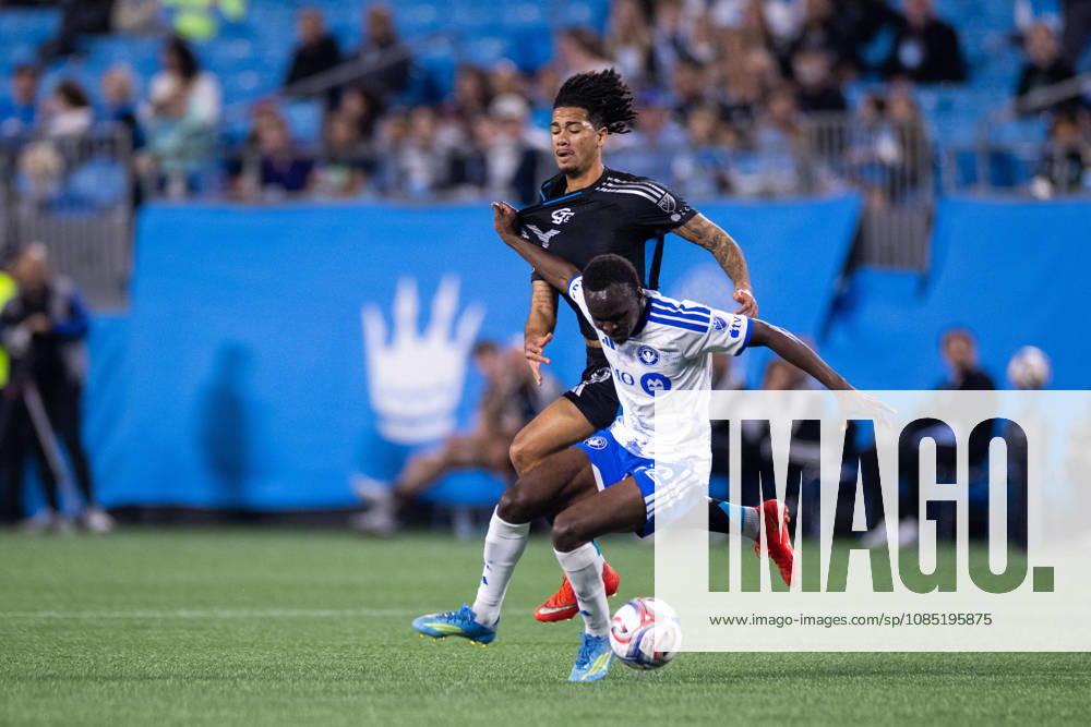 CF Montreal midfielder Victor Loturi (22) blocks Charlotte FC forward Idan Toklomati (9) during the first half of the MLS, Fussball Herren, USA match up at Bank of America Stadium in Charlotte, NC. Mandatory Credit: -Cal Media Charlotte United States - ZUMAc04_ 20261028_zma_c04_012