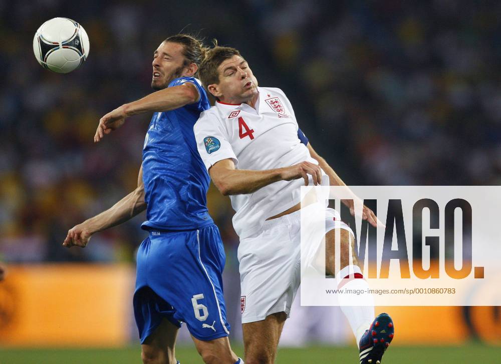 Federico Balzaretti of Italy and Steven Gerrard of England leap for the ball..Euro 2012 Quarter Final match, England v Italy at the Olympic Stadium, Kiev, Ukraine on the 24th June 2012. Pic Jake Badger SPORTIMAGE... .