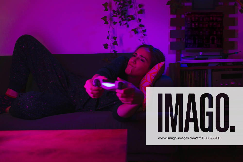IMAGO Creative: Sport Start-Up Girl trying to win a video game with her online friends during Covid-19 lockdown.