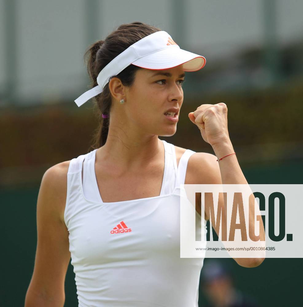 Serbian Ana Ivanovic reacts in her match on the third day of the 2012 Wimbledon championships in London, June 27, 2012. LON2012062701
