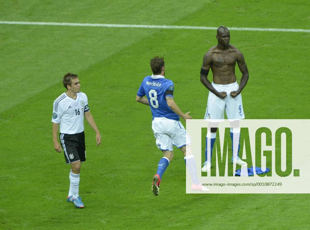 -- Philipp Lahm watches Mario Balotelli (R) of Italy celebrate with Claudio Marchisio after scoring during the semifinal match between Germany and Italy at the Euro 2012 football championships in Warsaw, Poland, June 28, 2012. (Xinhua Wu Wei) (jyc) POLAND-WARSAW-EURO 2012 FOOTBALL CHAMPIONSHIPS-SEMIFINAL-GERMANY VS ITALY