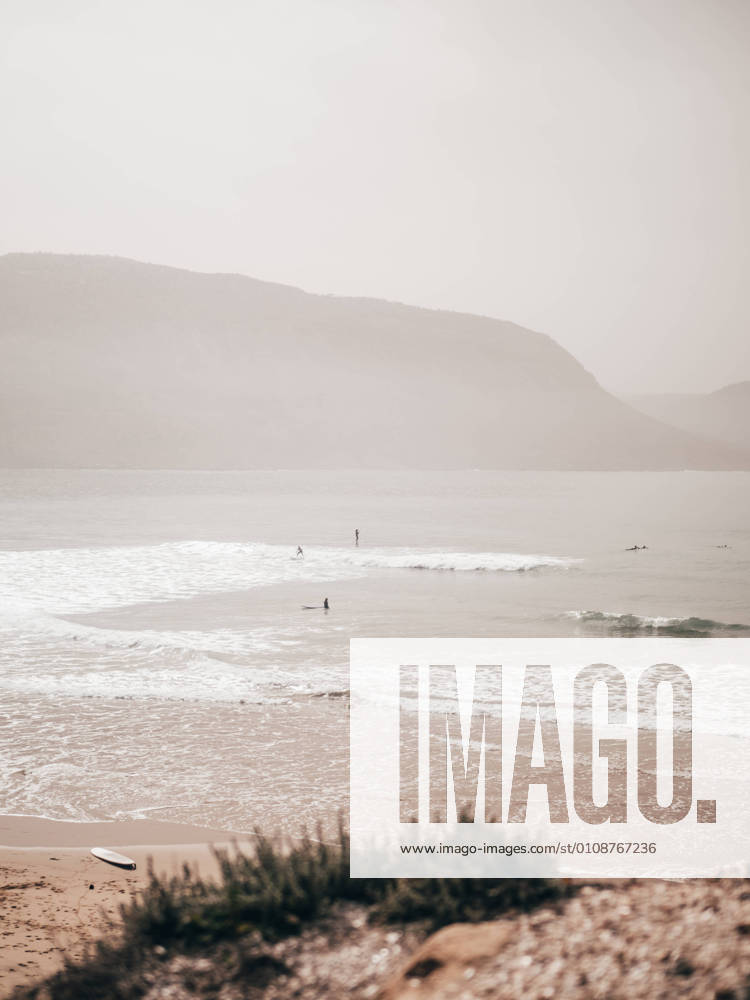 People surfing in ocean, Model released