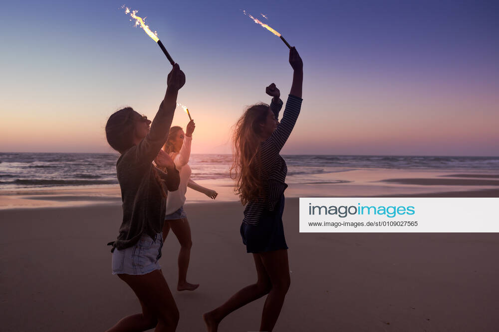 Beach Party Teenage friends running on a beach with fireworks, model releasedgirls, running, beach, fireworks, friends, group, teens, sparklers, young, party, women, holding, party, twinkle, teenagers, enjoy, fun, shine, sunset, night, hangout, celebrate, people, new, year, outdoors, rocketry, run, celebrating, summer, enjoying, happy, holiday, free, celebration, happiness, joy, vacation, leisure, youth, cool, together, freedom, hands, playful, playing, female,
