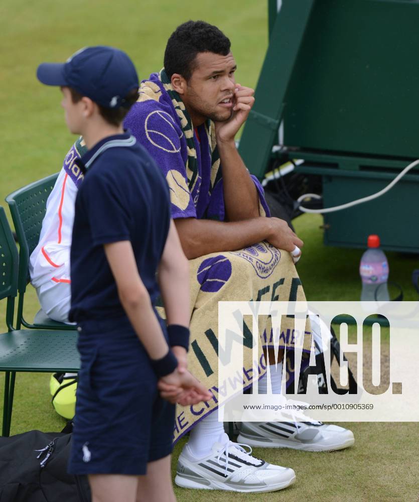 Wimbledon Week 2; Tennis Championships 2012 03 07 2012 Jo Wilfried Tsonga - France sits back down as rain begins to fall