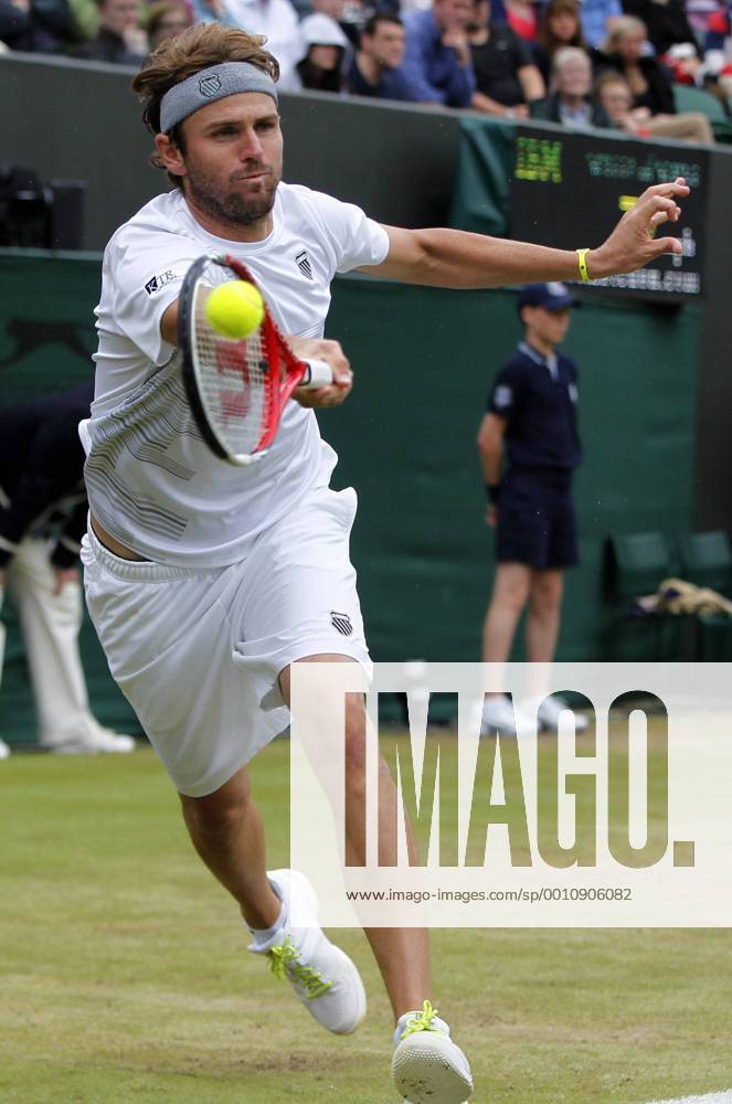 -- Mardy Fish of the United States returns the ball during the fourth round match of men s singles at the Wimbledon Championships 2012 in London, Britain on July 3, 2012.