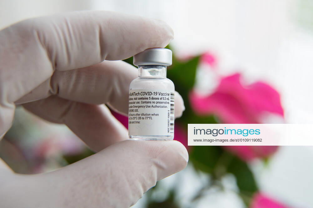 A gloved hand holds a vial of Pfizer-BioNTech COVID-19 vaccine..The first shipment of COVID-19 vaccine arrived in Slovenia and vaccination started in nursing homes across the country. Kranj Slovenia - ZUMAs197 20201227_zaa_s197_027