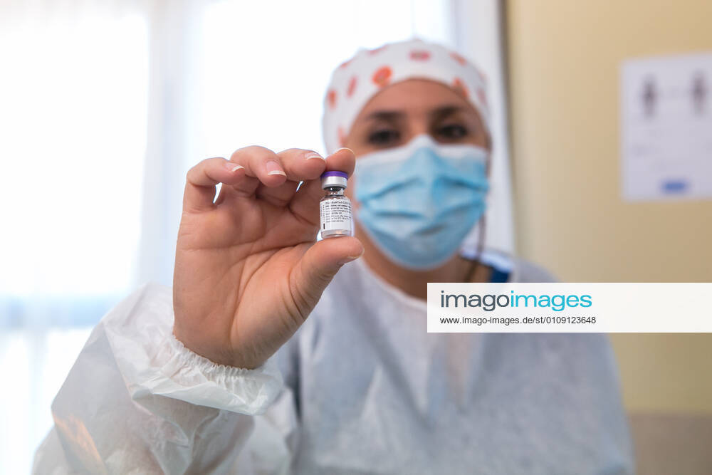 A sanitary shows a vial with the vaccine of Pfizer and BioNTech, the first day of vaccination against the Covid-19 in Spain, in the residence of elderly Rosalba de MÃ rida, in Extremadura (Spain), on December 27, 2020. The first doses of the vaccine developed by Pfizer and BioNtech laboratories arrived in Spain yesterday, December 26th, at a Pfizer warehouse in Guadalajara by land from Puurs (Belgium). From Monday, weekly deliveries will be made to the autonomous communities with an average of 350,000 doses prioritized for four population groups: residents and health and social-health personnel in homes for the elderly and disabled; front-line health personnel; other health and social-health personnel and large non-institutionalized depende