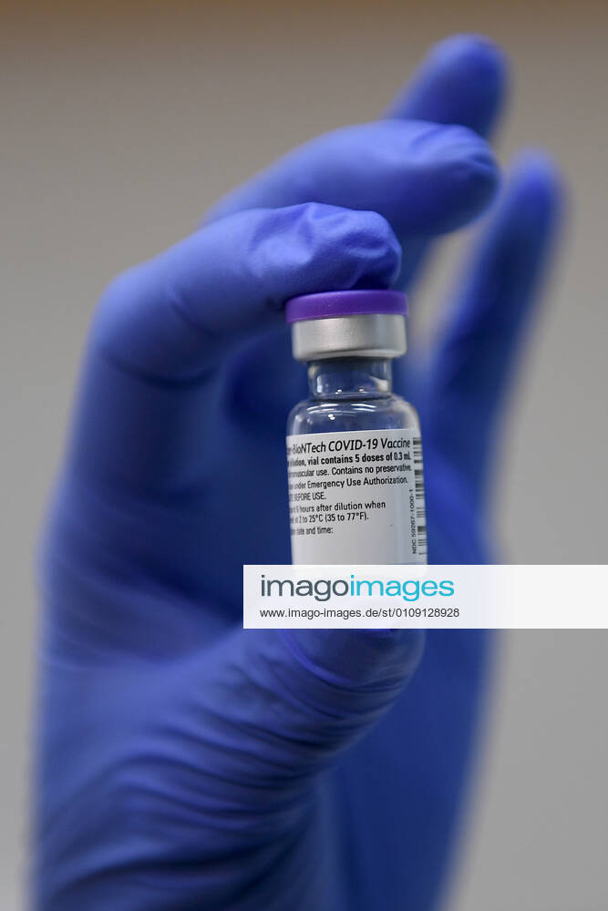 A nurse holds a vial of the Pfizer-BioNTech vaccine against COVID-19 at the General University Hospital in Prague, Czech Republic, December 27, 2020. (CTKxPhoto OndrejxDeml) CTKPhotoP202012270247301 dml 005