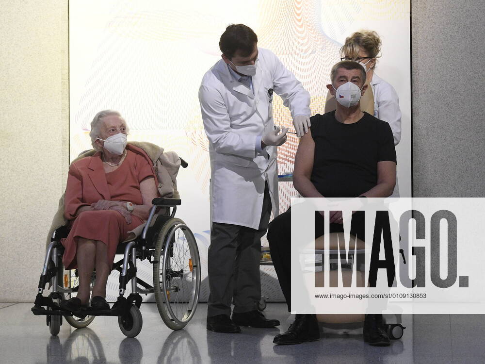 World War II veteran Emilie Repikova, left, watches as Czech Prime Minister Andrej Babis receives vaccine against COVID-19 at the Central Military Hospital in Prague, Czech Republic, December 27, 2020. (CTKxPhoto OndrejxDeml) CTKPhotoP202012270121101 _DML6082