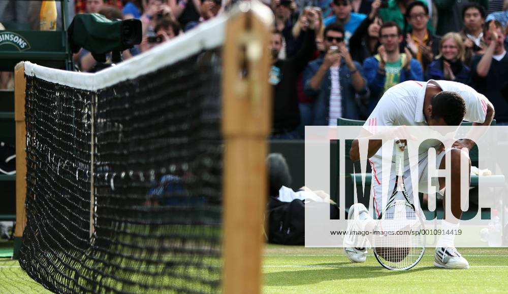Jo-Wilfried Tsonga of France gestures during the quarterfinal of men s singles at the Wimbledon Championships 2012 in London -