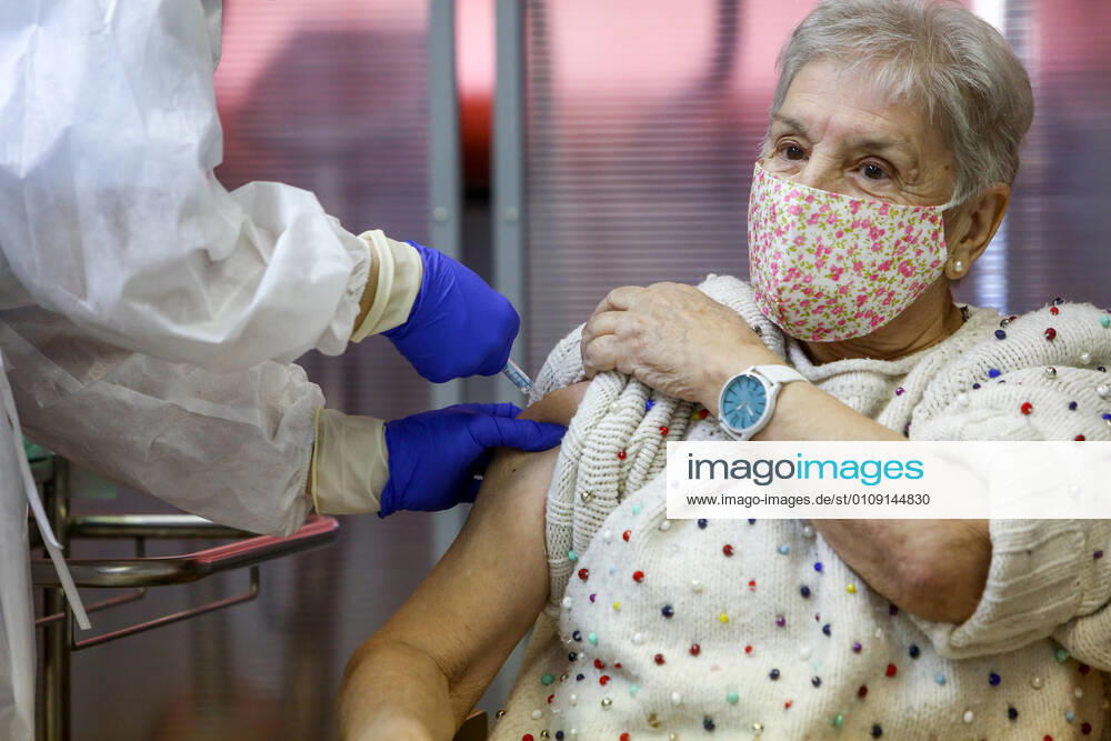 Maria is vaccinated in the Community of Madrid during the first day of vaccination against Covid-19 in Spain, at the Vallecas retirement home, belonging to the Madrid Agency for Social Care (AMAS), in Madrid (Spain), on 27 December 2020. The first 1,200 doses are administered in two more residences in the capital, the La Azaleas residence of the ASISPA Group in Ciudad Lineal and the Parque Almansa residence of the Ballesol Group in Moncloa Aravaca. The doses of the vaccine developed by Pfizer and BioNtech laboratories arrived in Spain yesterday, December 26th, at a Pfizer warehouse in Guadalajara by land from Puurs (Belgium). From Monday, weekly deliveries will be made to the autonomous communities with an average of 350,000 doses prioritiz