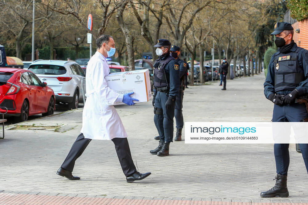 A health worker from the residence collects the box with the doses of the vaccine during the first day of vaccination against Covid-19 in Spain, in the Vallecas residence for the elderly, belonging to the Madrid Agency for Social Care (AMAS), in Madrid (Spain), on 27 December 2020. The first 1,200 doses are administered in two more residences in the capital, the La Azaleas residence of the ASISPA Group in Ciudad Lineal and the Parque Almansa residence of the Ballesol Group in Moncloa Aravaca. The doses of the vaccine developed by Pfizer and BioNtech laboratories arrived in Spain yesterday, December 26th, at a Pfizer warehouse in Guadalajara by land from Puurs (Belgium). From Monday, weekly deliveries will be made to the autonomous communiti