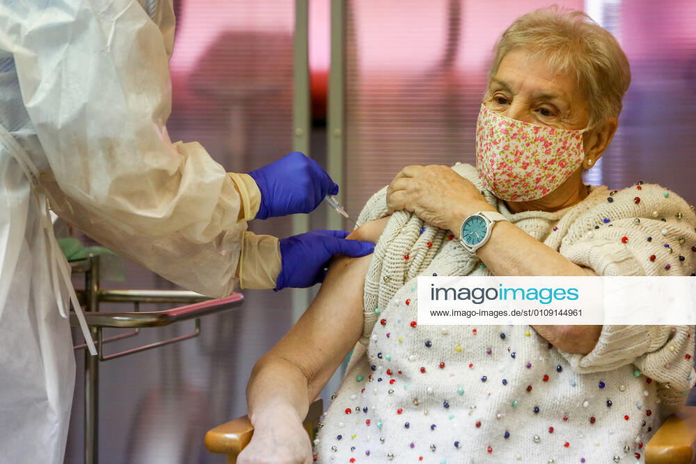 Maria is vaccinated in the Community of Madrid during the first day of vaccination against Covid-19 in Spain, at the Vallecas retirement home, belonging to the Madrid Agency for Social Care (AMAS), in Madrid (Spain), on 27 December 2020. The first 1,200 doses are administered in two more residences in the capital, the La Azaleas residence of the ASISPA Group in Ciudad Lineal and the Parque Almansa residence of the Ballesol Group in Moncloa Aravaca. The doses of the vaccine developed by Pfizer and BioNtech laboratories arrived in Spain yesterday, December 26th, at a Pfizer warehouse in Guadalajara by land from Puurs (Belgium). From Monday, weekly deliveries will be made to the autonomous communities with an average of 350,000 doses prioritiz