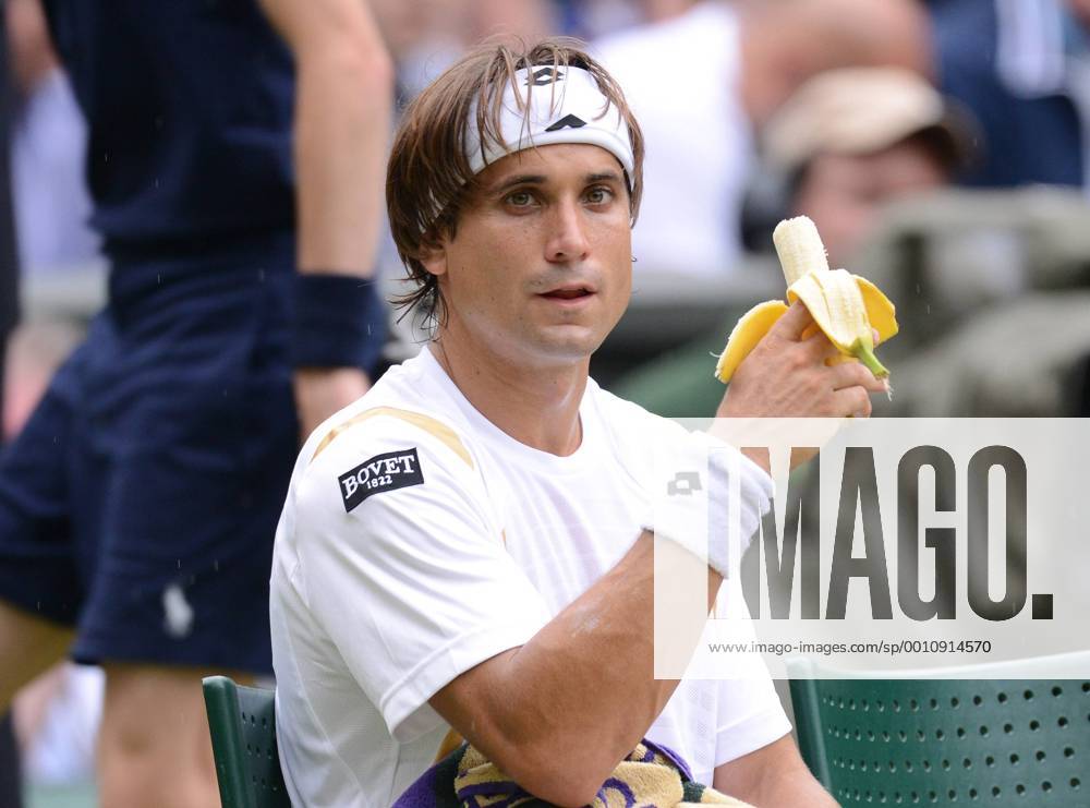 Wimbledon Week 2; Tennis Championships 2012 04 07 2012 - David Ferrer eats a Banana between a break