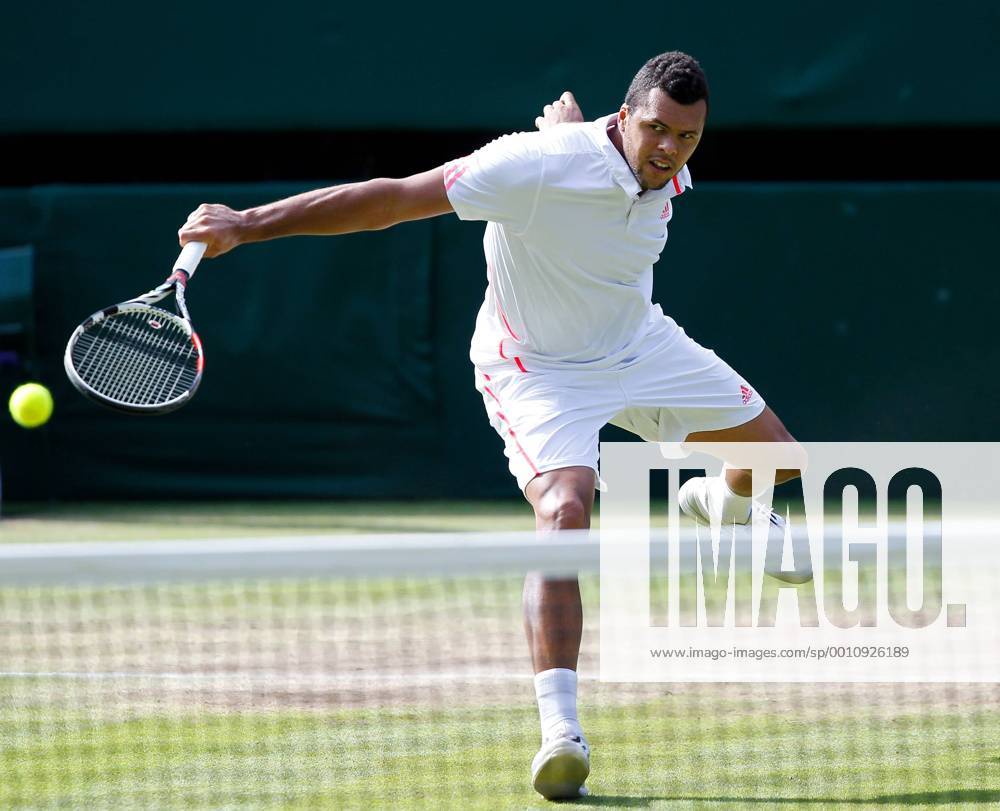Jo-Wilfried Tsonga of France returns the ball during the men s singles semifinal at the Wimbledon Championships tennis tournament 2012 in London, Britain, on July 6, 2012. Jo-Wilfried Tsonga lost 1-3. (Xinhua Yin Gang)(lm) BRITAIN-LONDON-TENNIS-WIMBLEDON CHAMPIONSHIPS-MEN S SINGLES-SEMIFINAL