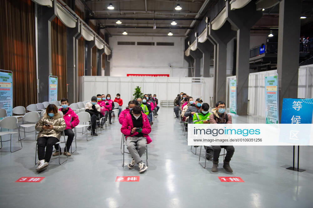 (210102) -- BEIJING, Jan. 2, 2021 -- People wait for receiving COVID-19 vaccines at a temporary vaccination site in Beijing, capital of China, Jan. 2, 2021. Beijing started administering COVID-19 vaccines among specific groups of people with higher infection risks. Nine groups of people aged 18 to 59 will receive the vaccine before the Spring Festival of 2021, which falls on Feb. 12. These include frontline customs inspectors of imported cold-chain goods and personnel working in the overseas and domestic transportation sector. ) CHINA-BEIJING-COVID-19-VACCINATION (CN) ChenxZhonghao