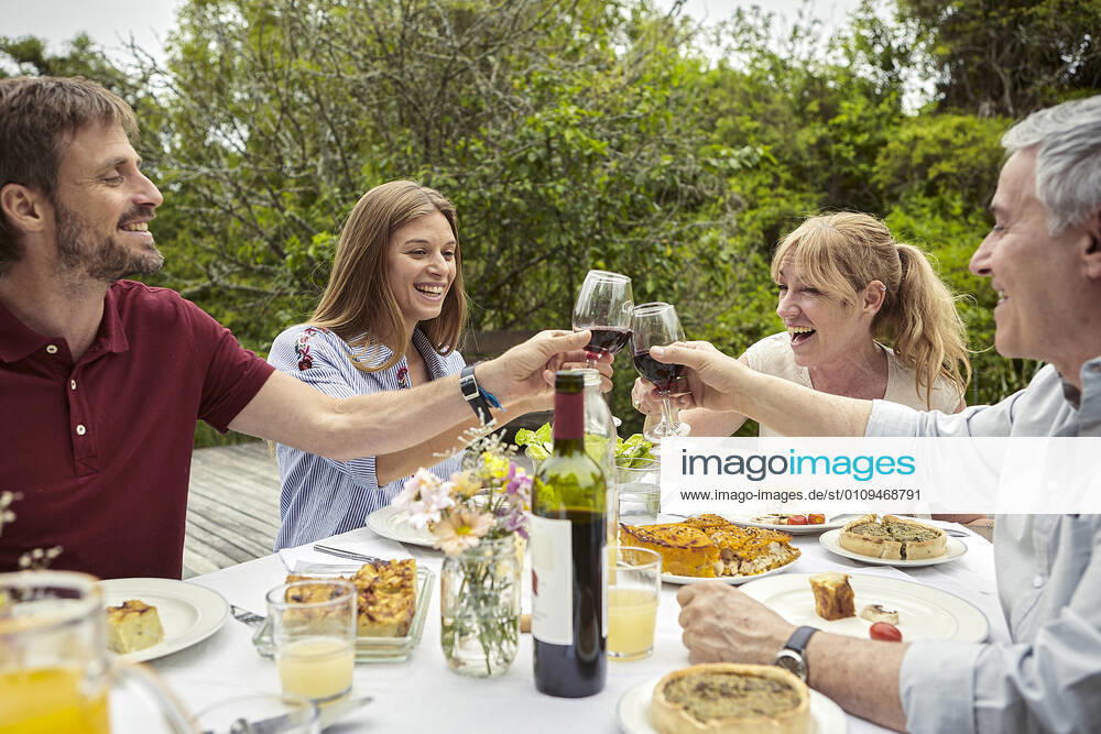 Happy family toasting wine glasses