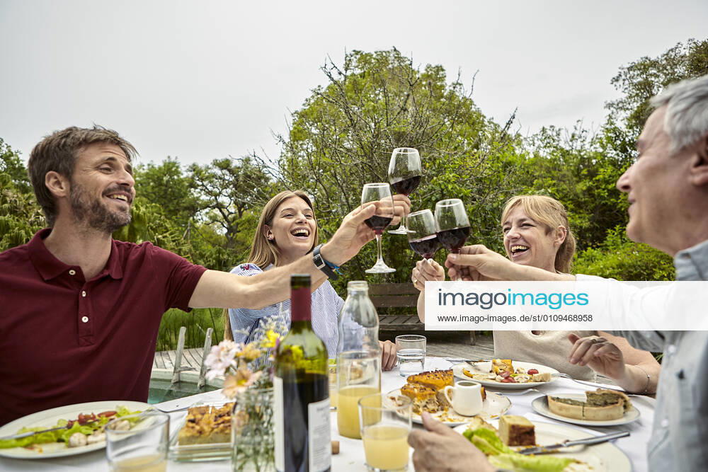 Happy family toasting wine glasses