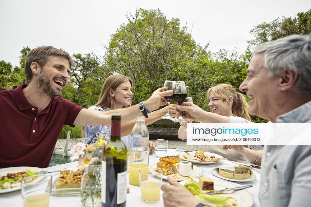 Happy family toasting wine glasses