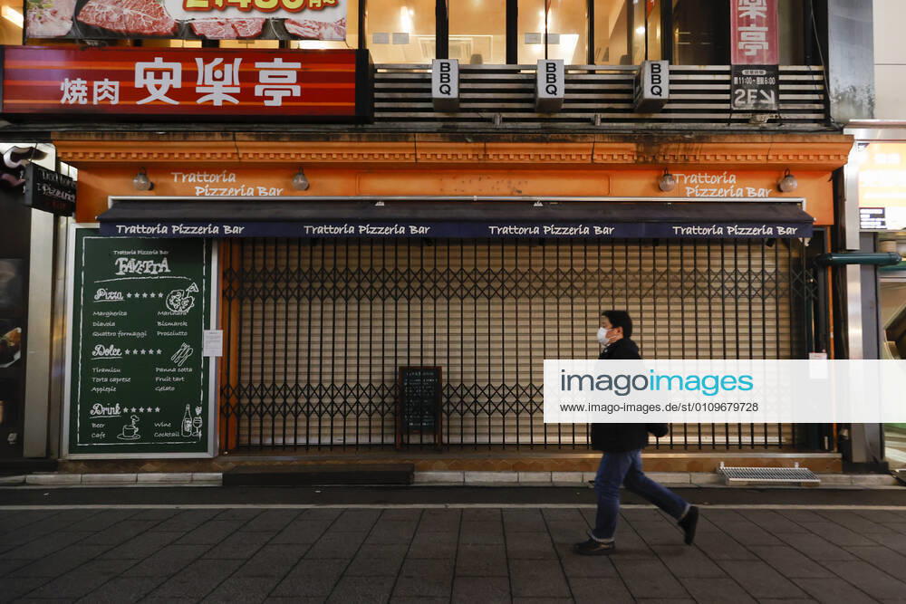 A man wearing a face mask leaves Kabukicho (the red-light district of Tokyo) after the establishments closed at 8 pm to stop the COVID-19 infections in the capital. Tokyo reported 1,494 new COVID-19 cases on January 10; following four days of over 2,000 cases, the daily infections count dropped for the first time after the state of emergency was declared in Tokyo, Kanagawa, Saitama, and Chiba prefectures. Tokyo Japan - ZUMAm191 20210110_zap_m191_017
