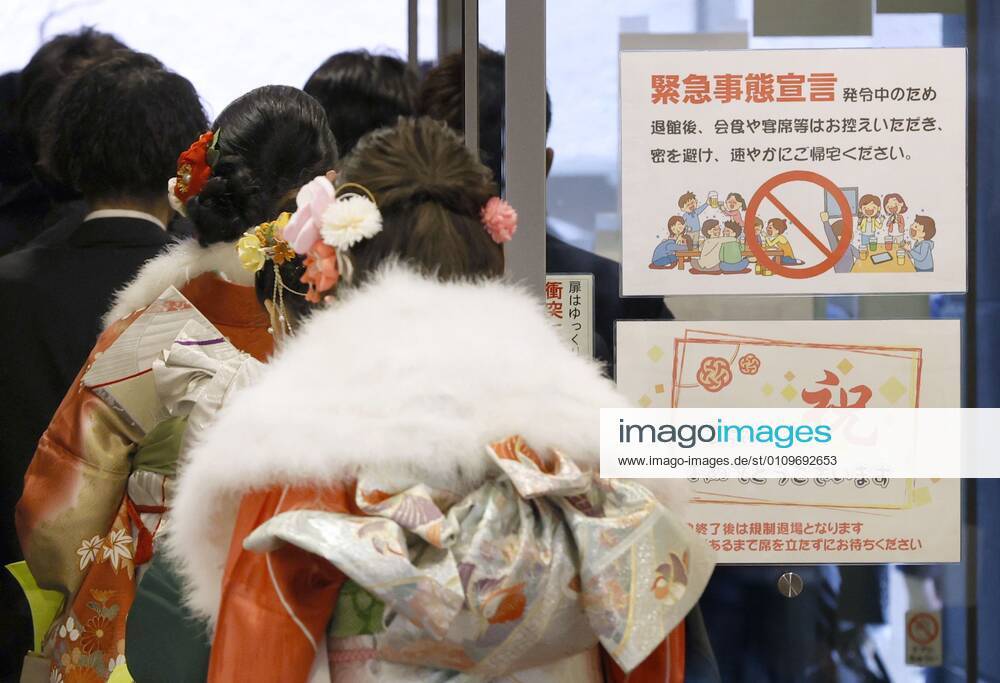 Coming-of-age ceremony under virus state of emergency Photo taken at the venue of a coming-of-age ceremony in Tokyo s Suginami Ward on Jan. 11, 2021, shows a sign asking attendees to refrain from eating or drinking together after the ceremony as the capital is under a coronavirus state of emergency.