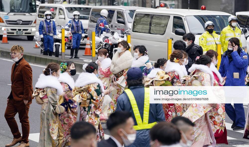 Coming-of-age ceremony under virus state of emergency Women in kimono walk near the venues of a coming-of-age ceremony in Yokohama near Tokyo on Jan. 11, 2021. The ceremony was split into two venues to avoid concentration of people as the Tokyo metropolitan area is under a coronavirus state of emergency amid the continued pandemic.