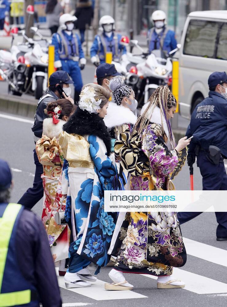 Coming-of-age ceremony under virus state of emergency Women in kimono walk near the venues of a coming-of-age ceremony in Yokohama near Tokyo on Jan. 11, 2021. The ceremony was split into two venues to avoid concentration of people as the Tokyo metropolitan area is under a coronavirus state of emergency amid the continued pandemic.