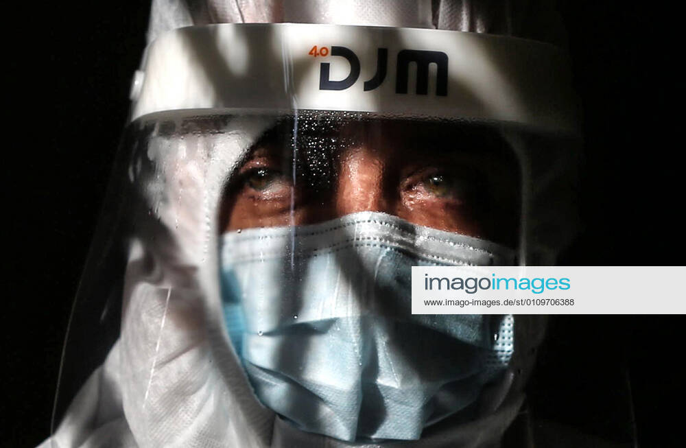 Deir Al-Balah, Gaza Strip, Palestinian Territory: A Palestinian medical worker wearing protective gear, takes a random swab sample for COVID-19 testing inside a mosque, in Deir al-Balah, central of Gaza Strip, on January 11, 2021. The Palestinian Authority (PA) has said it expects to receive its first COVID-19 vaccine doses in March under a deal with British drug giant AstraZeneca, and accused Israel of ignoring its responsibilities to ensure vaccines are available in occupied territory Deir Al-Balah Palestinian Territory - ZUMAap3_ 20210111_zaf_ap3_056