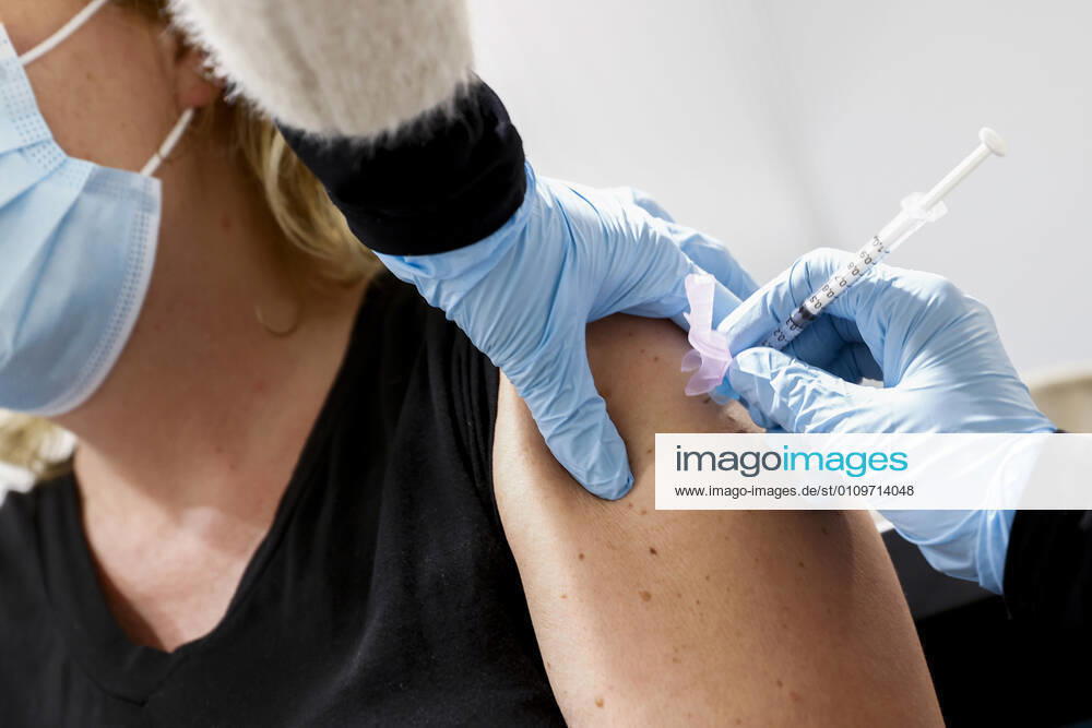 ASSEN A health care worker gets vaccinated against the coronavirus in the large test and vaccination location at the TT Circuit De GGD s Joint Health Services in Amsterdam, Drenthe and The Hague have started vaccinating health care personnel ANP VINCENT JANNINK