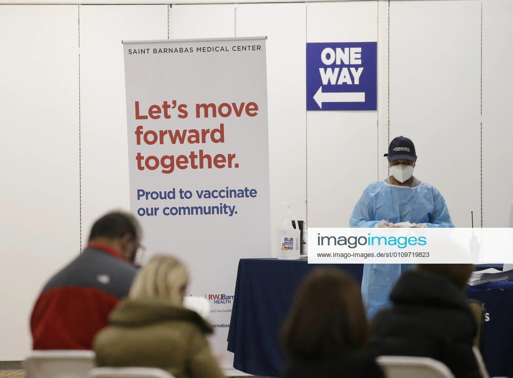 People arrive and get checked in to receive a coronavirus vaccine at an Essex County COVID-19 Vaccination Site located at a closed Sears retail store in the Livingston Mall in Livingston, New Jersey on Monday, January 11, 2021. Public health agencies and health-care groups are using the retailer s empty stores to deliver Vaccines in several locations around parts of the United States. NYP20210111114 JohnxAngelillo