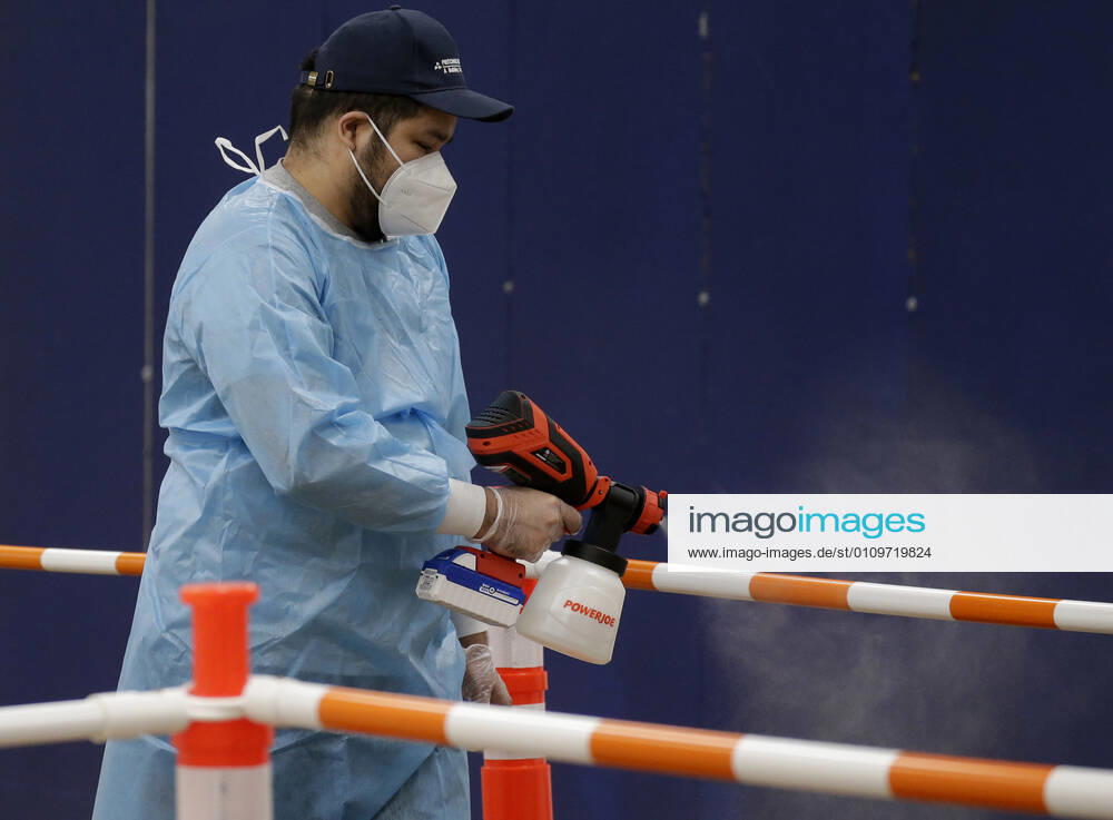 Workers sanitize areas where people enter to receive a coronavirus vaccine at an Essex County COVID-19 Vaccination Site located at a closed Sears retail store in the Livingston Mall in Livingston, New Jersey on Monday, January 11, 2021. Public health agencies and health-care groups are using the retailer s empty stores to deliver Vaccines in several locations around parts of the United States. NYP20210111115 JohnxAngelillo