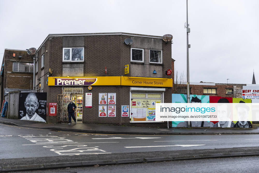 A man wearing a face mask walks out of Premier convenience store in Wales. Newport United Kingdom - ZUMAs197 20210111_zab_s197_027