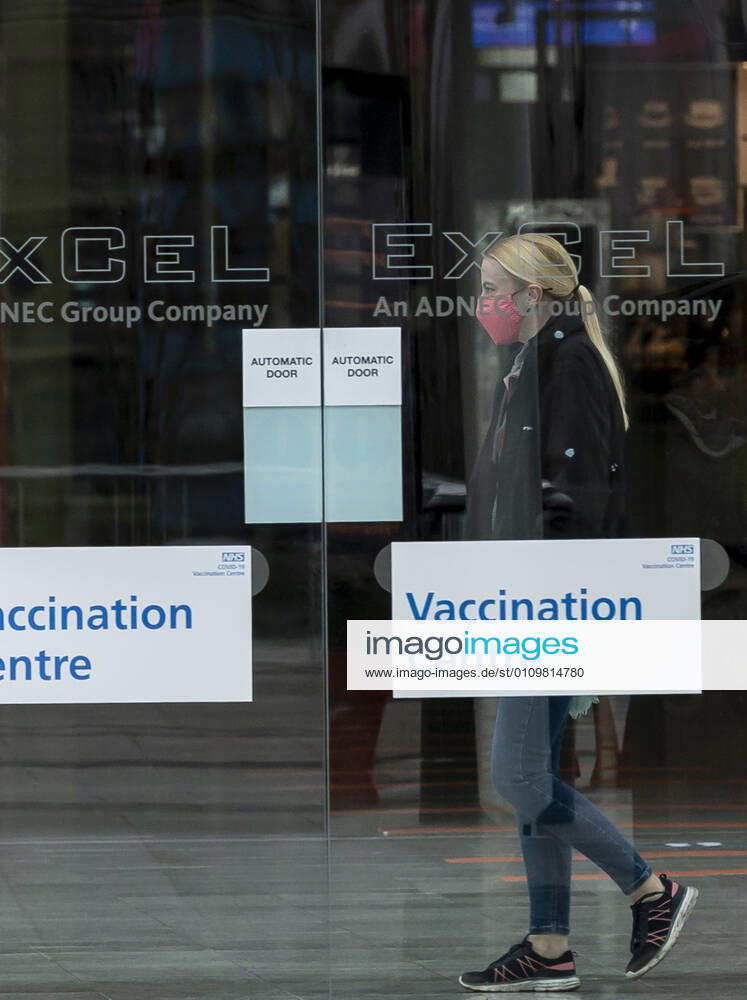 (210113) -- LONDON, Jan. 13, 2021 -- A woman wearing a face mask is seen in the Vaccination Centre at ExCel exhibition centre in London, Britain, Jan. 12, 2021. British Prime Minister Boris Johnson on Monday warned against false complacency as the country is seeking to speed up the coronavirus vaccine rollout. According to the prime minister, 2.4 million coronavirus jabs have been administered across Britain. Seven new mass vaccination sites in England opened Monday, as the country races against time to bring the pandemic under control. ) BRITAIN-LONDON-COVID-19-VACCINE ROLLOUT HanxYan