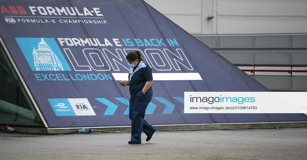 (210113) -- LONDON, Jan. 13, 2021 -- A staff wearing a face mask walks into the Vaccination Centre at ExCel exhibition centre in London, Britain, on Jan. 12, 2021. British Prime Minister Boris Johnson on Monday warned against false complacency as the country is seeking to speed up the coronavirus vaccine rollout. According to the prime minister, 2.4 million coronavirus jabs have been administered across Britain. Seven new mass vaccination sites in England opened Monday, as the country races against time to bring the pandemic under control. ) BRITAIN-LONDON-COVID-19-VACCINE ROLLOUT HanxYan