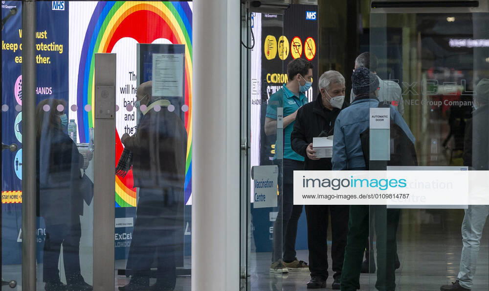 (210113) -- LONDON, Jan. 13, 2021 -- People are seen inside the Vaccination Centre at ExCel exhibition centre in London, Britain, Jan. 12, 2021. British Prime Minister Boris Johnson on Monday warned against false complacency as the country is seeking to speed up the coronavirus vaccine rollout. According to the prime minister, 2.4 million coronavirus jabs have been administered across Britain. Seven new mass vaccination sites in England opened Monday, as the country races against time to bring the pandemic under control. ) BRITAIN-LONDON-COVID-19-VACCINE ROLLOUT HanxYan