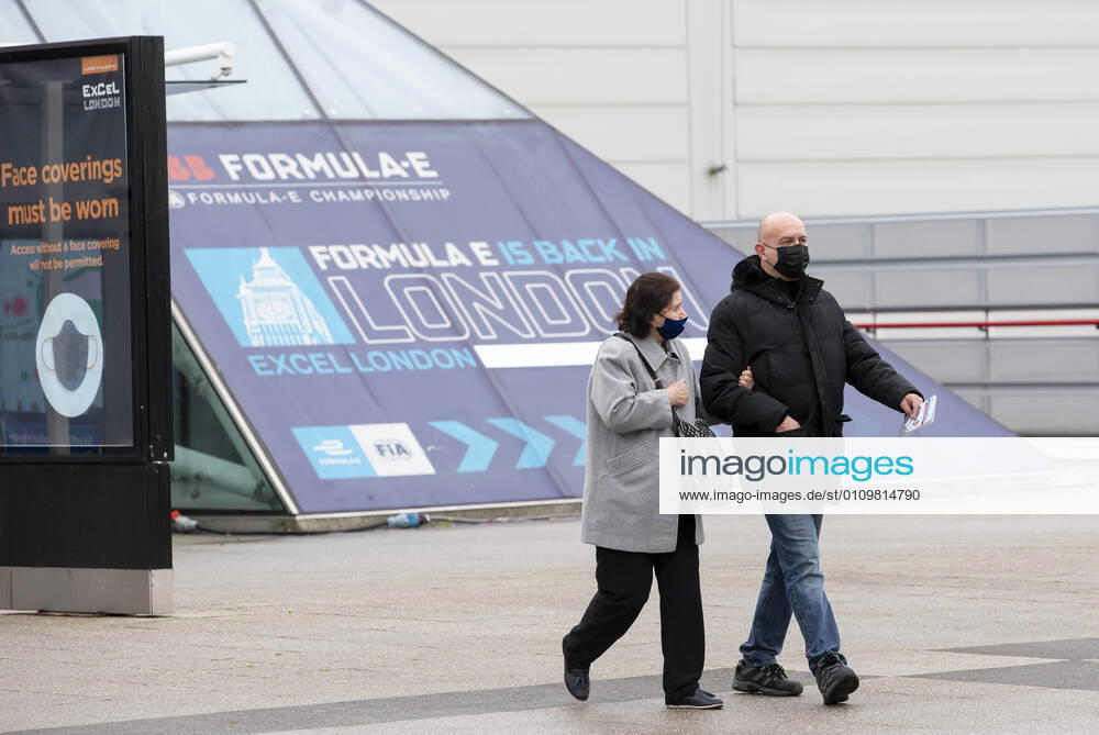(210113) -- LONDON, Jan. 13, 2021 -- People wearing face masks walk out of the Vaccination Centre at ExCel exhibition centre after receiving the vaccination in London, Britain, Jan. 12, 2021. British Prime Minister Boris Johnson on Monday warned against false complacency as the country is seeking to speed up the coronavirus vaccine rollout. According to the prime minister, 2.4 million coronavirus jabs have been administered across Britain. Seven new mass vaccination sites in England opened Monday, as the country races against time to bring the pandemic under control. ) BRITAIN-LONDON-COVID-19-VACCINE ROLLOUT HanxYan