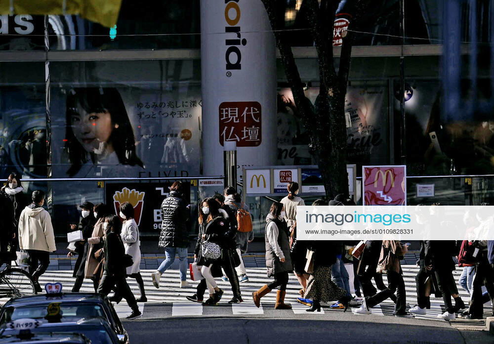 Expansion of coronavirus state of emergency in Japan People wearing face masks walk in Nagoya, central Japan, on Jan. 13, 2021, amid the coronavirus pandemic. Prime Minister Yoshihide Suga is set to declare a state of emergency in seven additional prefectures, including Aichi, later in the day, amid a resurgence of virus infections across the country.