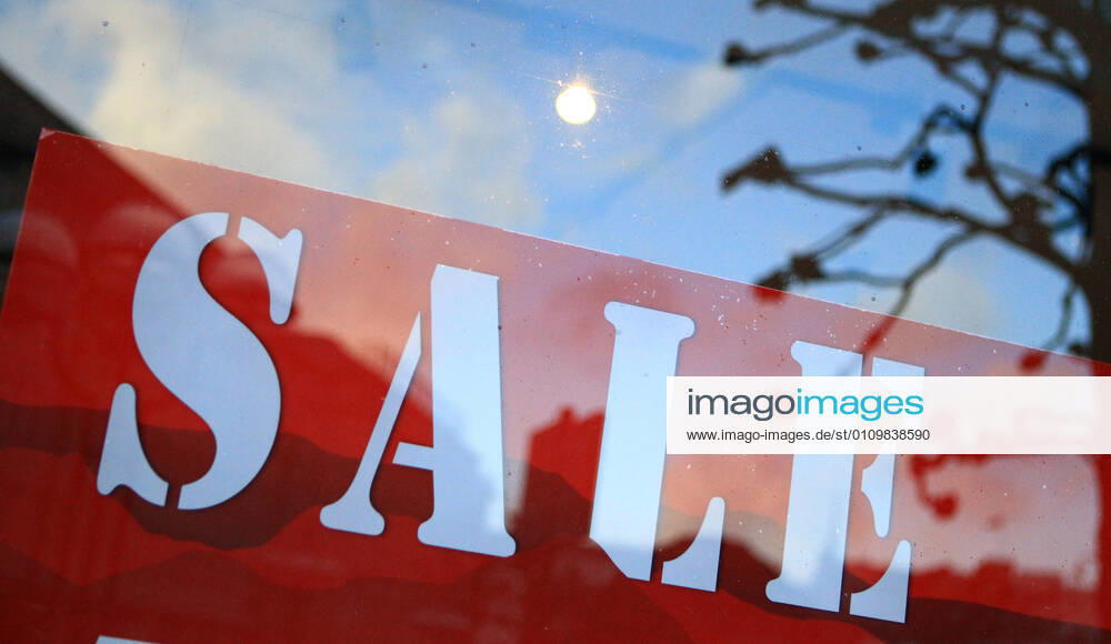 On the window of a closed shop in the city centre of Hamburg a sale is advertised Altstadt Hamburg
