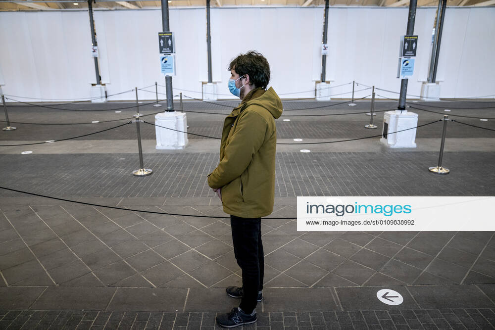 People stand in line in connection with the first vaccine center in the Capital Region opening in OEksnehallen, at Halmtorvet in Copenhagen, Wednesday 13 January 2021, Copenhagen Denmark