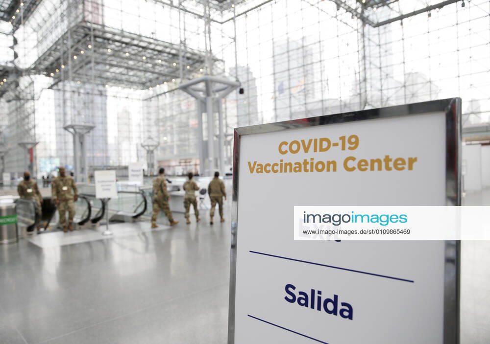 Signs for COVID-19 Vaccintaion are set up around the inside as patients arrive and go through the check in process to received a COVID-19 vaccination at the Jacob K. Javits Convention Center in New York City on Wednesday, January 13, 2021. The Javits Convention Center which served as a massive field hospital last spring when New York City was the epicenter of the pandemic, now will serve as a huge vaccine distribution center. NYP20210113113 JohnxAngelillo