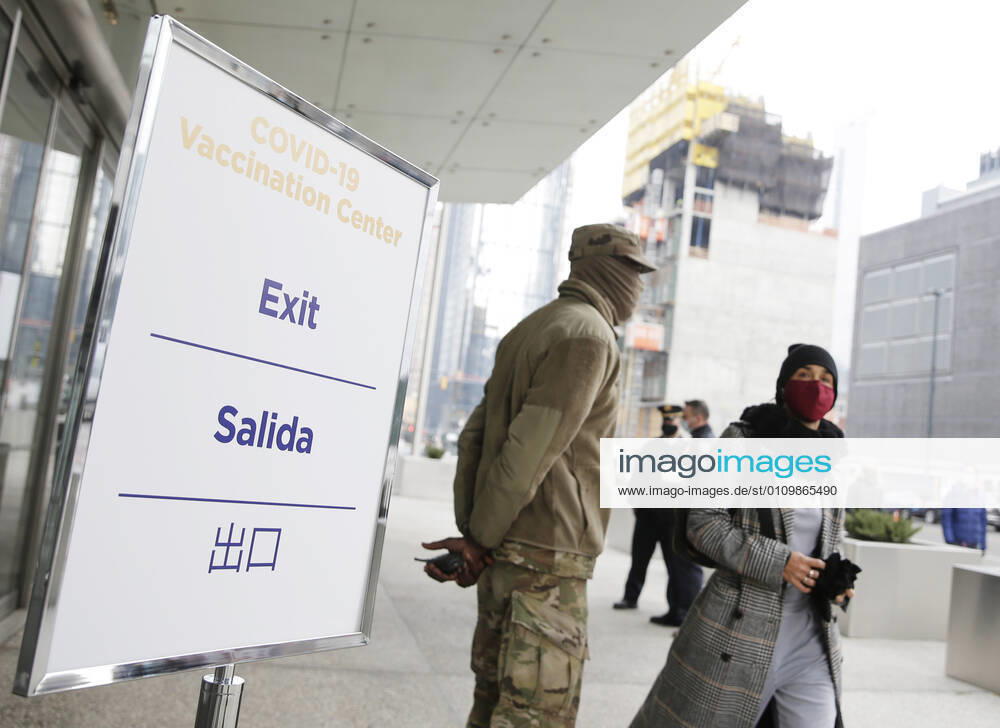 Signs for COVID-19 Vaccintaion are set up outside as patients arrive and go through the check in process to received a COVID-19 vaccination at the Jacob K. Javits Convention Center in New York City on Wednesday, January 13, 2021. The Javits Convention Center which served as a massive field hospital last spring when New York City was the epicenter of the pandemic, now will serve as a huge vaccine distribution center. NYP20210113120 JohnxAngelillo