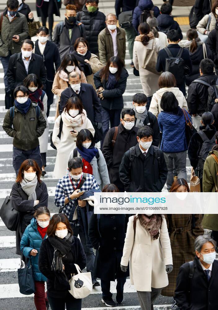 Day after Japan expands coronavirus emergency to 7 more prefectures People wearing face masks walk in Osaka s Umeda area on Jan. 14, 2021. Japanese Prime Minister Yoshihide Suga declared a state of emergency in seven additional prefectures, including Osaka, the previous day amid the continued spread of the novel coronavirus.