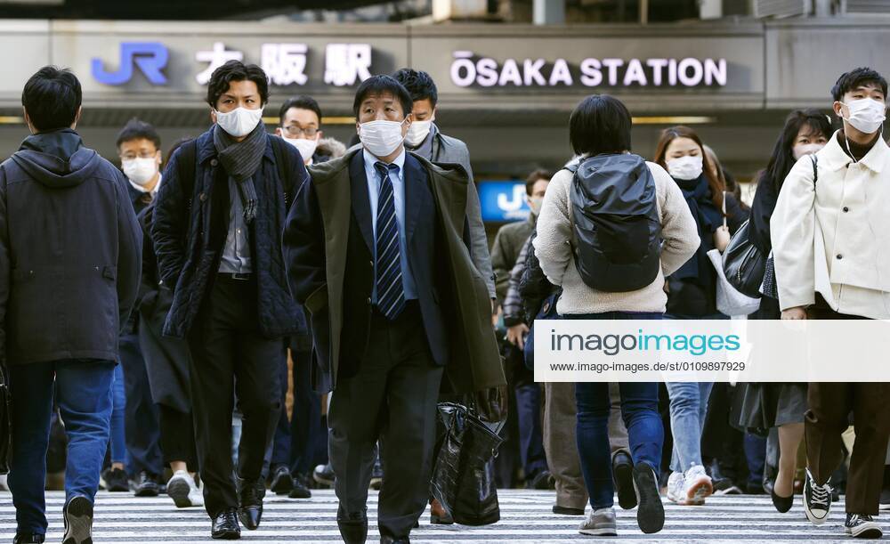 Day after Japan expands coronavirus emergency to 7 more prefectures People wearing face masks walk in Osaka s Umeda area on Jan. 14, 2021. Prime Minister Yoshihide Suga declared a state of emergency in seven additional prefectures, including Osaka, the previous day amid the continued spread of the novel coronavirus.